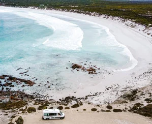 2-berth motorhome parked beside a white-sand beach near Adelaide, South Australia