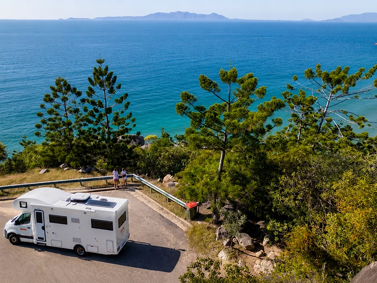 Campervan parked at a coastal lookout overlooking the sea near Townsville