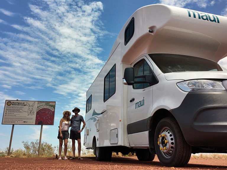 Couple beside a Maui motorhome rental during a road trip through the Kimberley near Broome