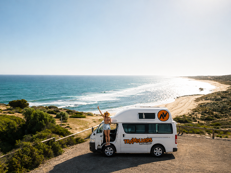 Traveller beside a motorhome rental overlooking the Yorke Peninsula coastline in South Australia