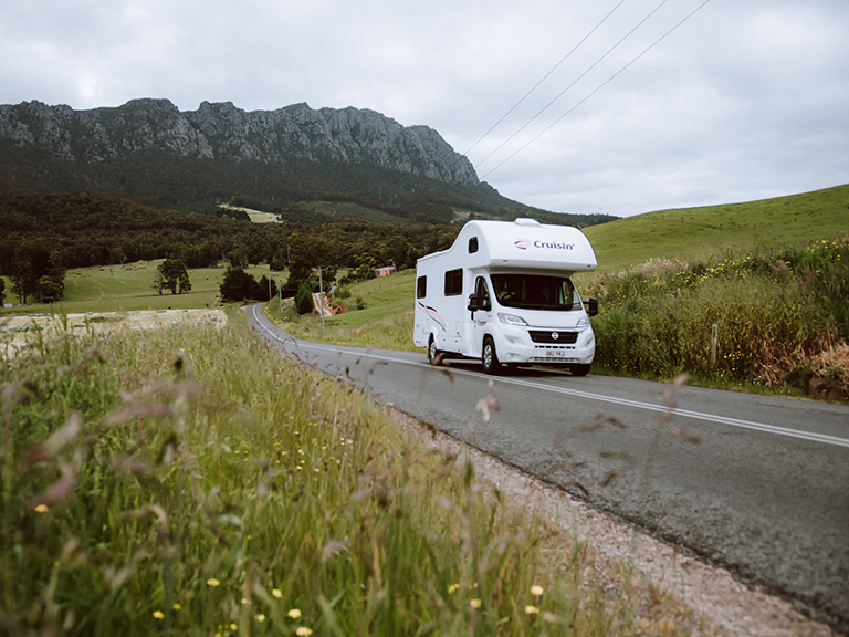 Cruisin motorhome hire vehicle travelling along Claude Road near Sheffield in northern Tasmania