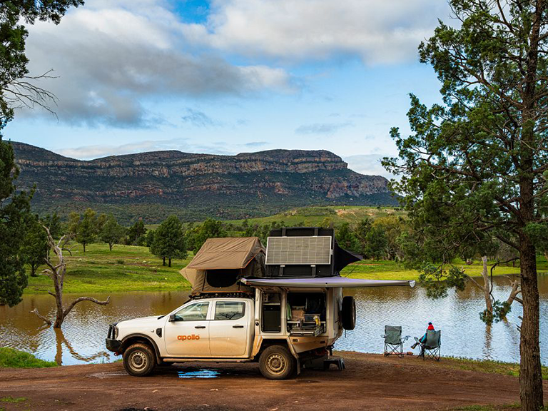 Apollo 4WD campervan hire vehicle parked beside the water at Rawnsley Park Station in South Australia