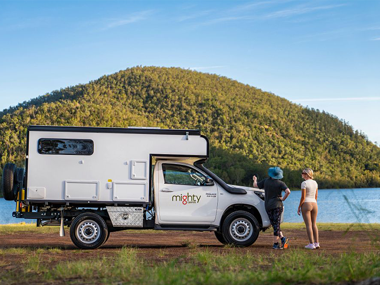 Mighty 4WD motorhome rental beside Lake Moogerah in Queensland with two travellers
